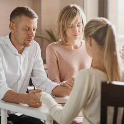 beautiful-family-praying-before-eating_23-2148769384