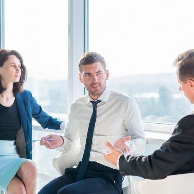 group-businesspeople-having-conversation-office_23-2147899638