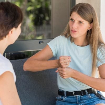two-women-using-sign-language-communicate-with-each-other_23-2148681034