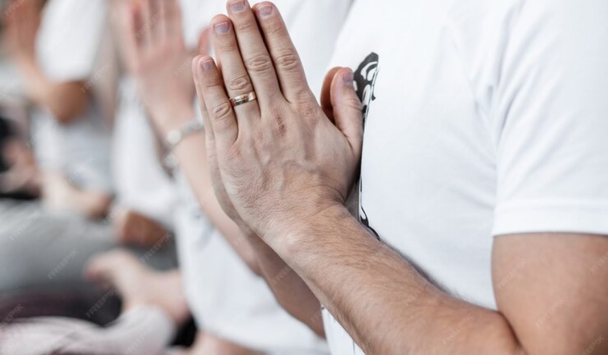yoga-pilates-training-group-people-relax-meditate-doing-stretching-exercises-fitness-studio-close-up_338491-9810